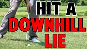 how to hit from a downhill lie